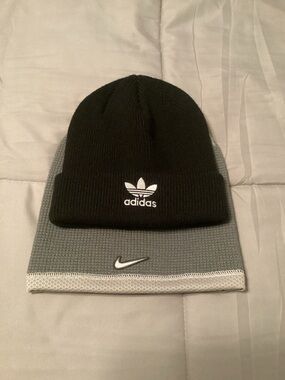 Two beanies, Adidas and Nike.